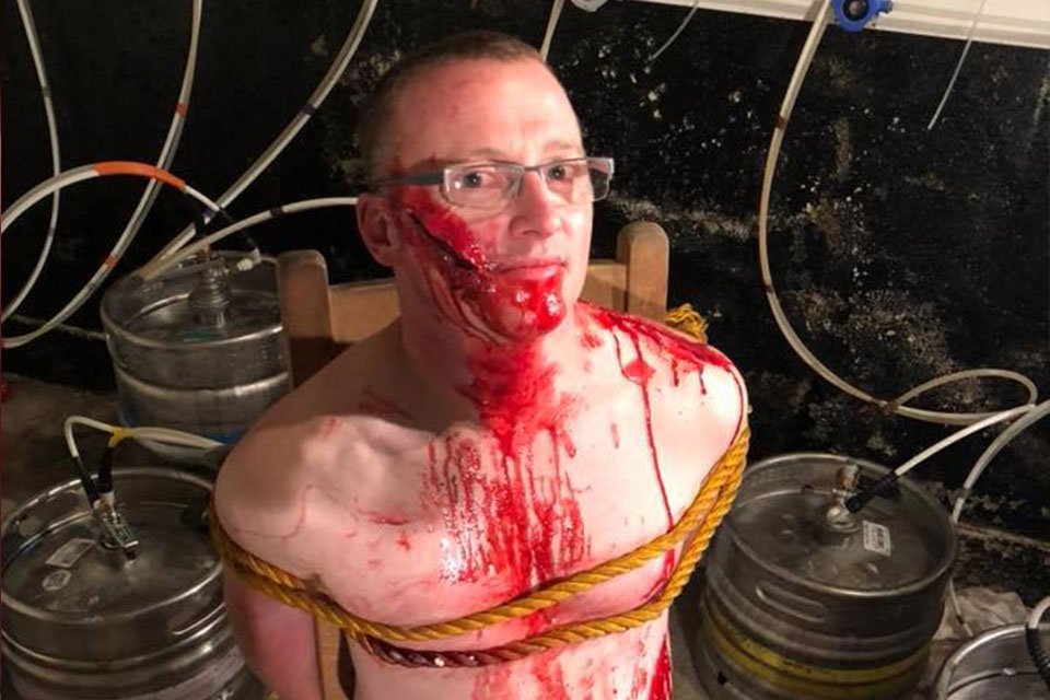 The High Priest naked and covered in blood. Photo shot from "They tried to put a spell on me" video